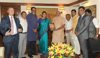 First copy of 'QS BRICS 2014 University Rankings' presented to PM